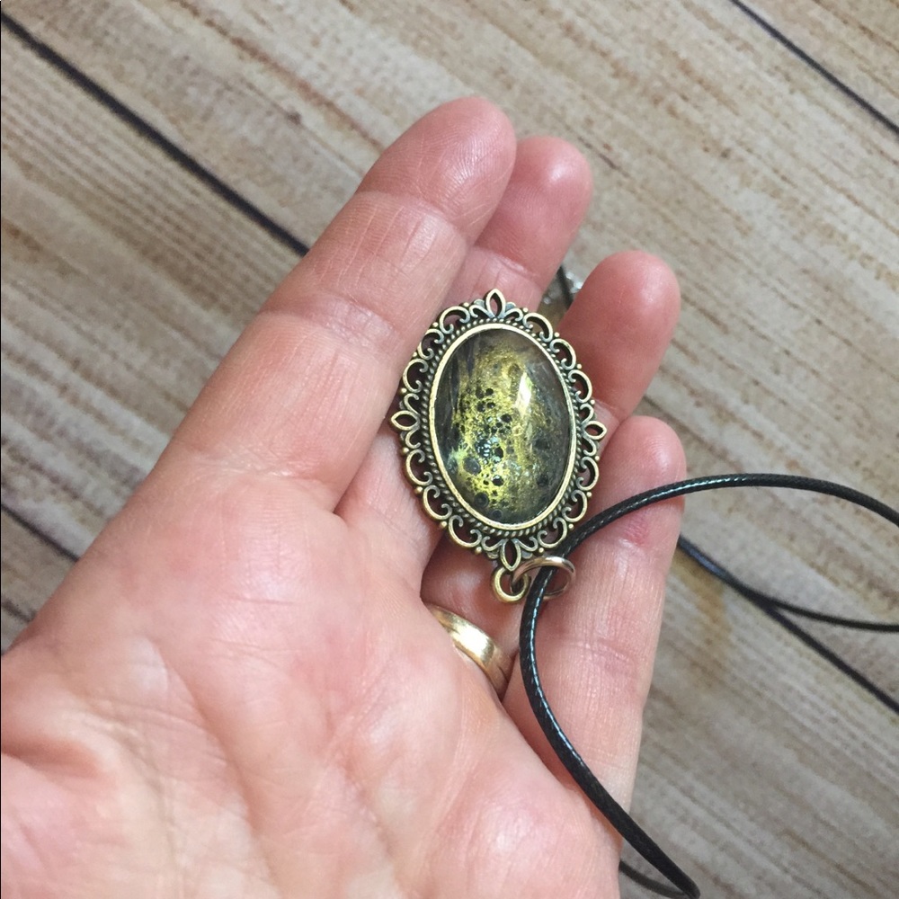 Resin necklace pendant with cord. black and gold. Vintage style